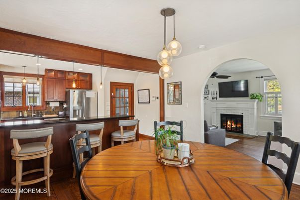 Dining room, Fireplace, Interior, Kitchen, Pendant Lights, Wood Texture Flooring
