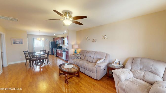 Chandelier, Dining room, Interior, Kitchen, Living room, Pendant Lights, Recessed Lighting, Wood Texture Flooring