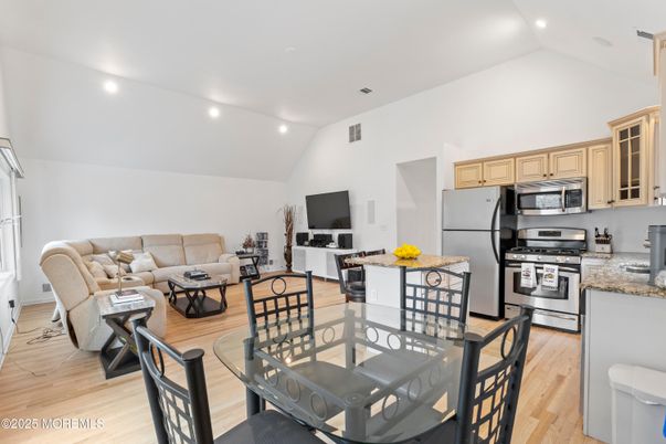 Dining room, Interior, Kitchen, Living room, Recessed Lighting, Stainless Steel Appliances, Wood Texture Flooring