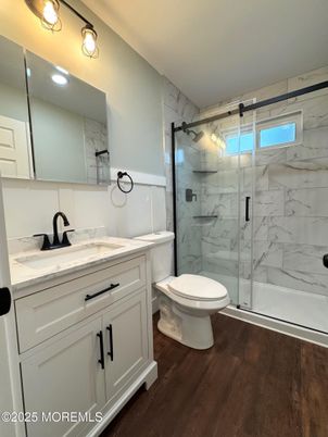 Bathroom, Glass Shower, Interior, Marble Walls, Recessed Lighting, Wood Texture Flooring