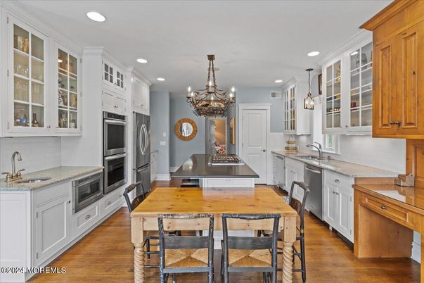 Chandelier, Interior, Kitchen, Pendant Lights, Recessed Lighting, Stainless Steel Appliances, Wood Texture Flooring