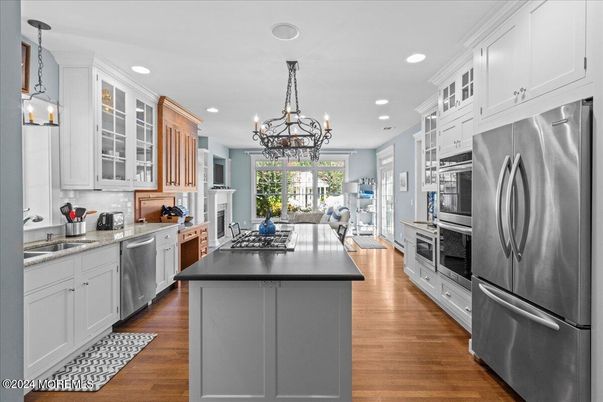 Chandelier, Interior, Kitchen, Pendant Lights, Recessed Lighting, Stainless Steel Appliances, Wood Texture Flooring