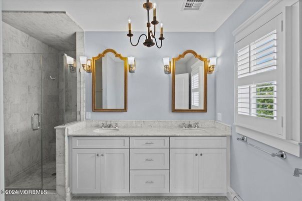 Bathroom, Chandelier, Dual Sink Vanities, Glass Shower, Interior, Marble Walls