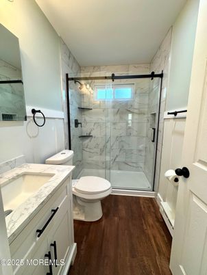 Bathroom, Glass Shower, Interior, Marble Walls, Wood Texture Flooring