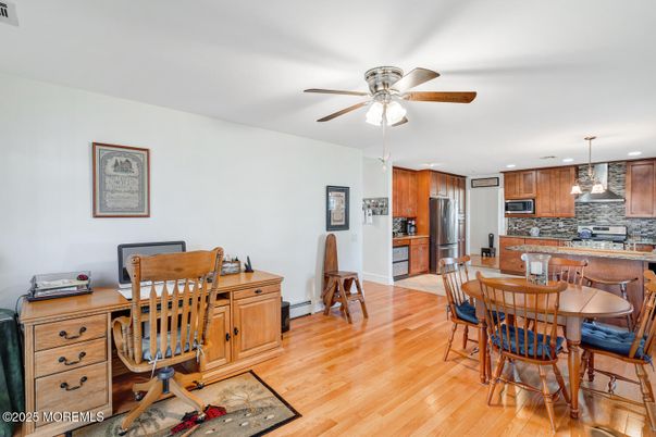 Dining room, Interior, Kitchen, Pendant Lights, Recessed Lighting, Stainless Steel Appliances, Wood Texture Flooring