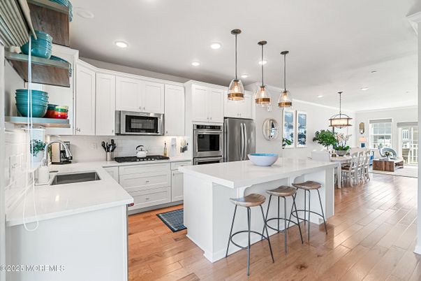 Dining room, Interior, Kitchen, Pendant Lights, Recessed Lighting, Stainless Steel Appliances, Wood Texture Flooring
