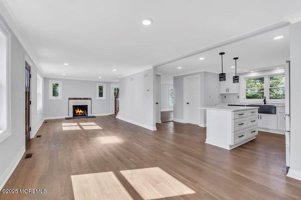 Empty room, Fireplace, Interior, Kitchen, Pendant Lights, Recessed Lighting, Wood Texture Flooring