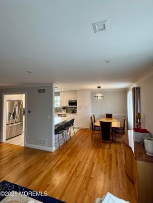 Dining room, Interior, Kitchen, Pendant Lights, Stainless Steel Appliances, Wood Texture Flooring