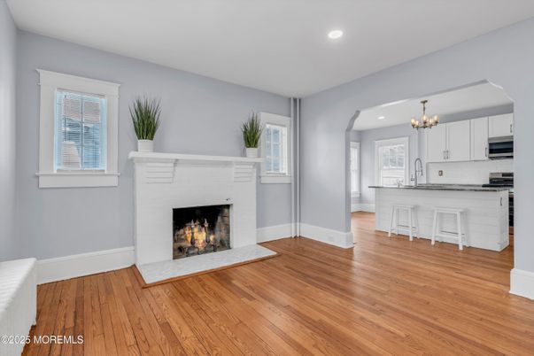 Chandelier, Fireplace, Interior, Kitchen, Recessed Lighting, Wood Texture Flooring