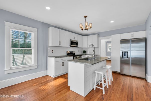 Chandelier, Interior, Kitchen, Recessed Lighting, Stainless Steel Appliances, Wood Texture Flooring