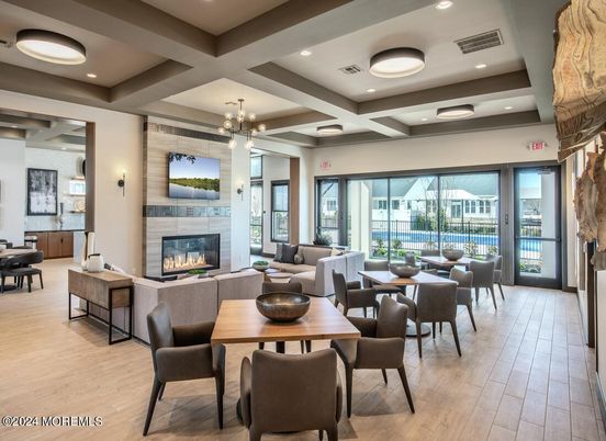 Dining room, Fireplace, Interior, Living room, Pendant Lights, Recessed Lighting, Wood Texture Flooring