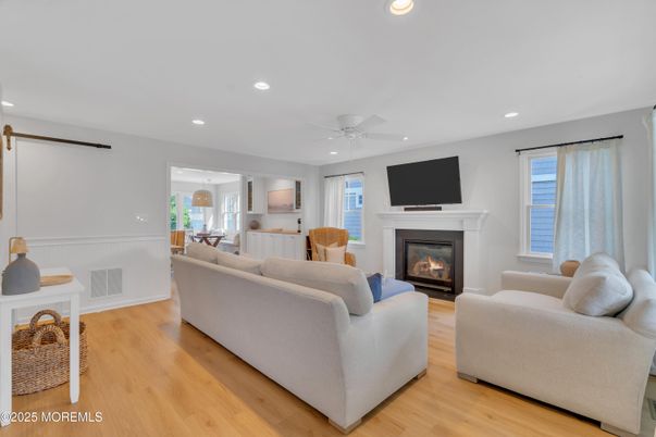 Dining room, Fireplace, Interior, Living room, Recessed Lighting, Wood Texture Flooring