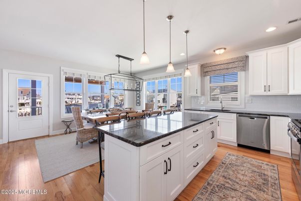 Dining room, Interior, Kitchen, Pendant Lights, Recessed Lighting, Stainless Steel Appliances, Wood Texture Flooring