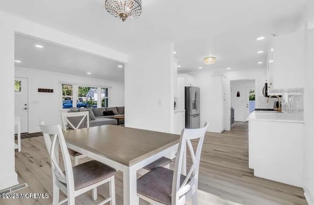 Dining room, Interior, Kitchen, Living room, Recessed Lighting, Stainless Steel Appliances, Wood Texture Flooring