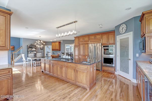 Chandelier, Dining room, Interior, Kitchen, Pendant Lights, Recessed Lighting, Stainless Steel Appliances, Wood Texture Flooring