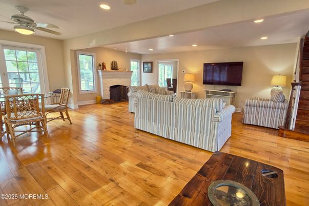Dining room, Fireplace, Interior, Living room, Recessed Lighting, Wood Texture Flooring