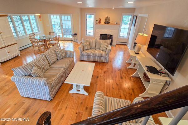 Dining room, Fireplace, Interior, Living room, Recessed Lighting, Wood Texture Flooring