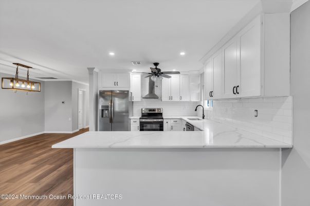 Interior, Kitchen, Recessed Lighting, Stainless Steel Appliances, Wood Texture Flooring