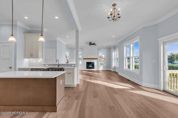Chandelier, Fireplace, Interior, Kitchen, Pendant Lights, Recessed Lighting, Wood Texture Flooring