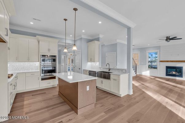 Fireplace, Interior, Kitchen, Pendant Lights, Recessed Lighting, Stainless Steel Appliances, Wood Texture Flooring