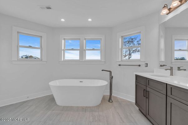 Bathroom, Dual Sink Vanities, Free Standing Baths, Interior, Recessed Lighting, Wood Texture Flooring