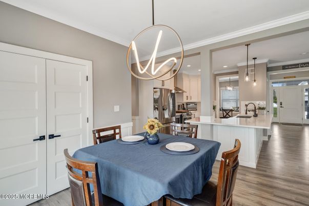 Dining room, Interior, Kitchen, Pendant Lights, Recessed Lighting, Stainless Steel Appliances, Wood Texture Flooring