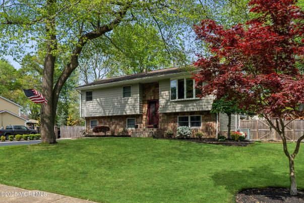 Backyard, Exterior, Facade, Brick Facade, Raised Ranch