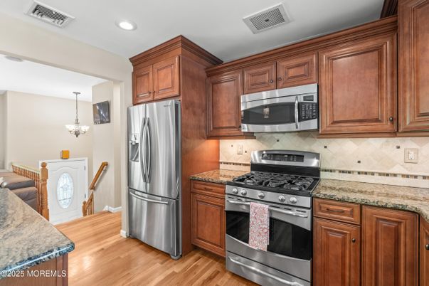 Chandelier, Interior, Kitchen, Recessed Lighting, Stainless Steel Appliances, Wood Texture Flooring