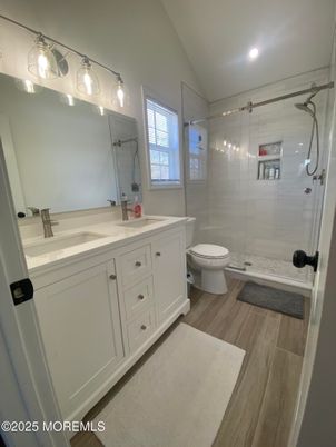 Bathroom, Dual Sink Vanities, Glass Shower, Interior, Recessed Lighting, Wood Texture Flooring