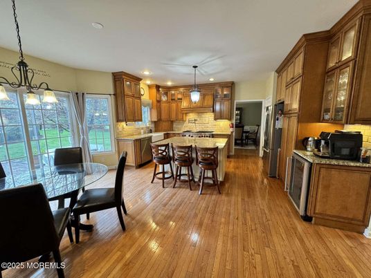Dining room, Interior, Kitchen, Pendant Lights, Recessed Lighting, Stainless Steel Appliances, Wood Texture Flooring