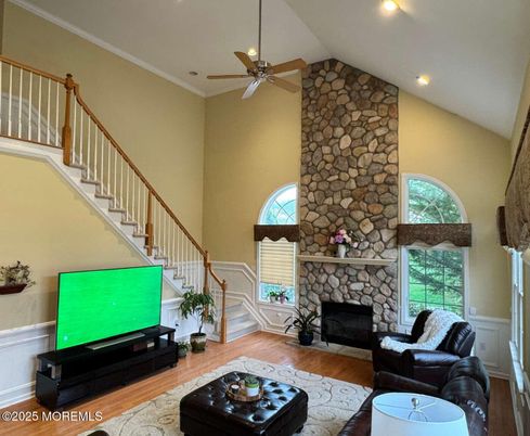 Fireplace, Interior, Living room, Recessed Lighting, Stone Walls, Wood Texture Flooring