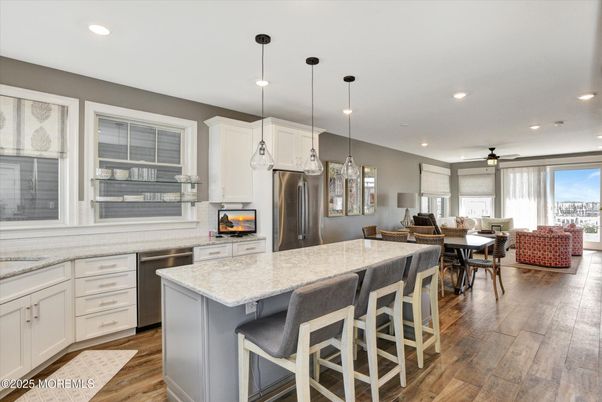 Dining room, Interior, Kitchen, Pendant Lights, Recessed Lighting, Stainless Steel Appliances, Wood Texture Flooring