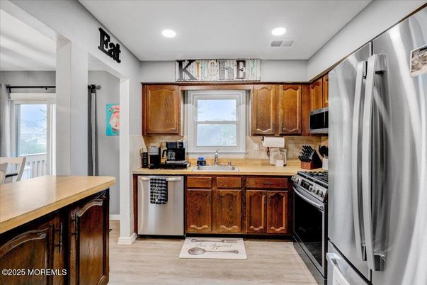 Interior, Kitchen, Recessed Lighting, Stainless Steel Appliances, Wood Texture Flooring