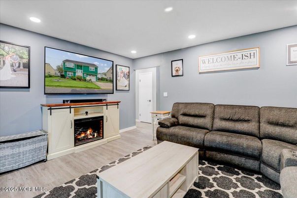 Fireplace, Interior, Living room, Recessed Lighting, Wood Texture Flooring