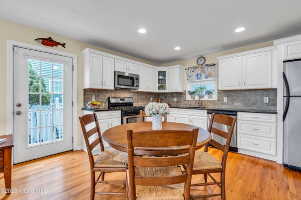 Dining room, Interior, Kitchen, Recessed Lighting, Stainless Steel Appliances, Wood Texture Flooring