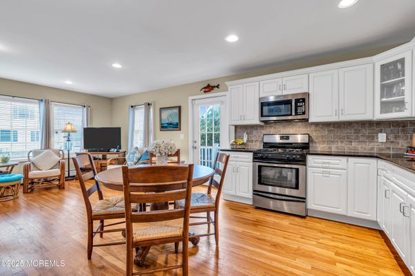 Dining room, Interior, Kitchen, Recessed Lighting, Stainless Steel Appliances, Wood Texture Flooring