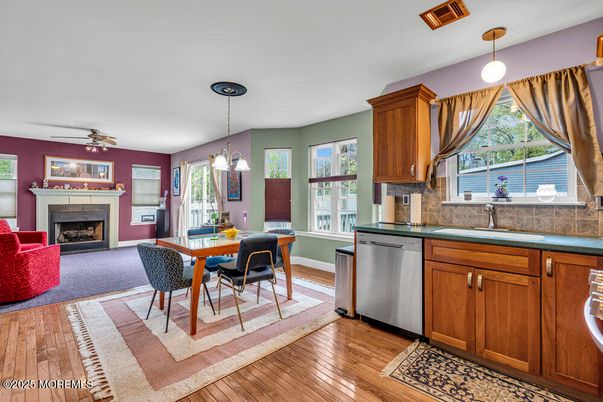 Dining room, Fireplace, Interior, Kitchen, Pendant Lights, Wood Texture Flooring