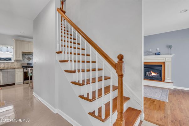 Fireplace, Interior, Kitchen, Recessed Lighting, Stainless Steel Appliances, Wood Texture Flooring
