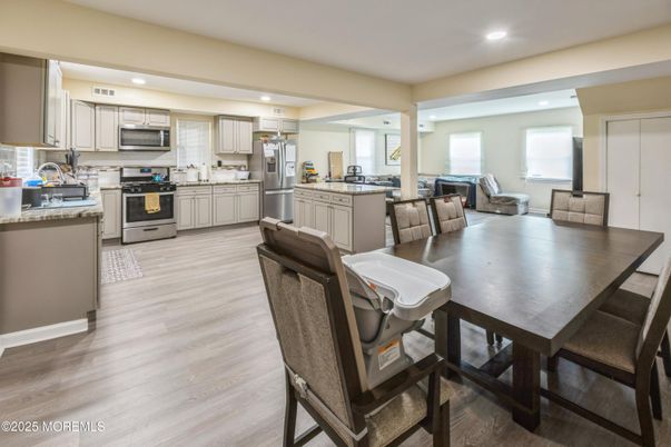 Dining room, Interior, Kitchen, Living room, Recessed Lighting, Stainless Steel Appliances, Wood Texture Flooring