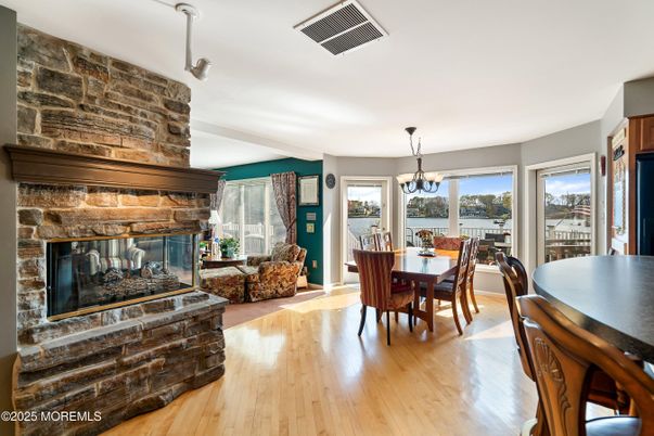 Chandelier, Dining room, Fireplace, Interior, Living room, Pendant Lights, Wood Texture Flooring