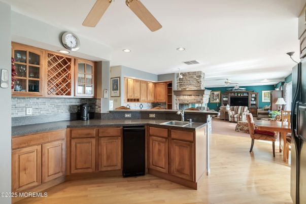 Dining room, Fireplace, Interior, Kitchen, Living room, Recessed Lighting, Wood Texture Flooring