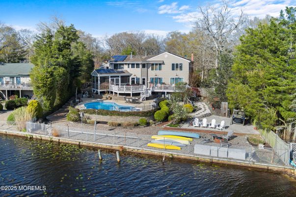 Exterior, Lake, Pool, Solar Panels