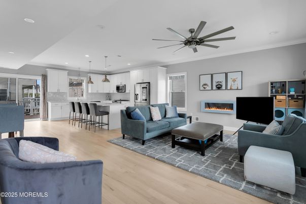 Fireplace, Interior, Kitchen, Living room, Pendant Lights, Recessed Lighting, Stainless Steel Appliances, Wood Texture Flooring