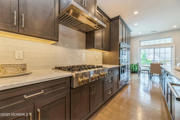 Dining room, Interior, Kitchen, Recessed Lighting, Stainless Steel Appliances, Wood Texture Flooring