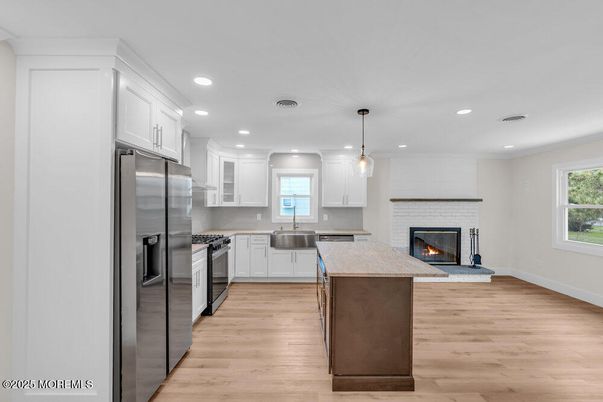 Fireplace, Interior, Kitchen, Pendant Lights, Recessed Lighting, Stainless Steel Appliances, Wood Texture Flooring