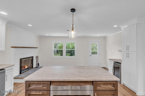 Empty room, Fireplace, Interior, Kitchen, Pendant Lights, Recessed Lighting, Wood Texture Flooring