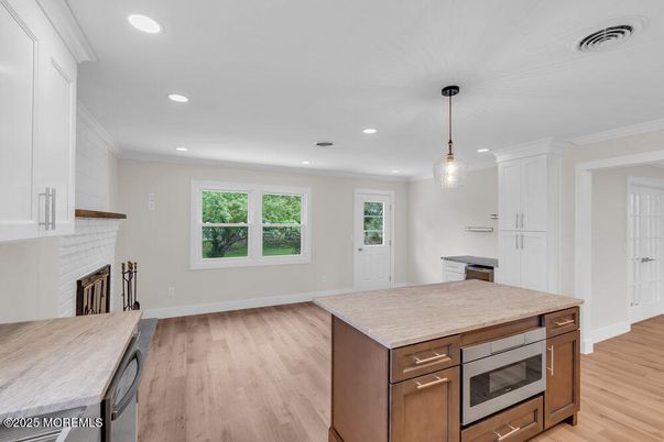 Fireplace, Interior, Kitchen, Pendant Lights, Recessed Lighting, Stainless Steel Appliances, Wood Texture Flooring