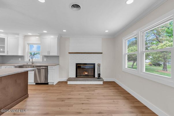 Fireplace, Interior, Kitchen, Recessed Lighting, Wood Texture Flooring
