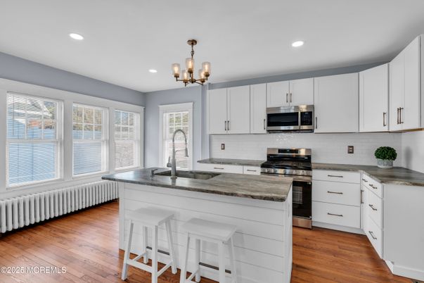 Chandelier, Interior, Kitchen, Recessed Lighting, Stainless Steel Appliances, Wood Texture Flooring