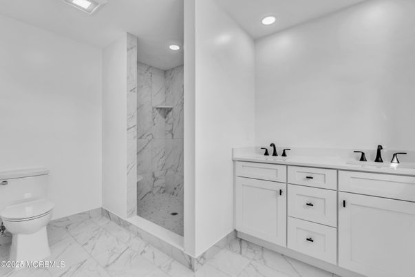 Bathroom, Dual Sink Vanities, Interior, Marble, Marble Walls, Recessed Lighting